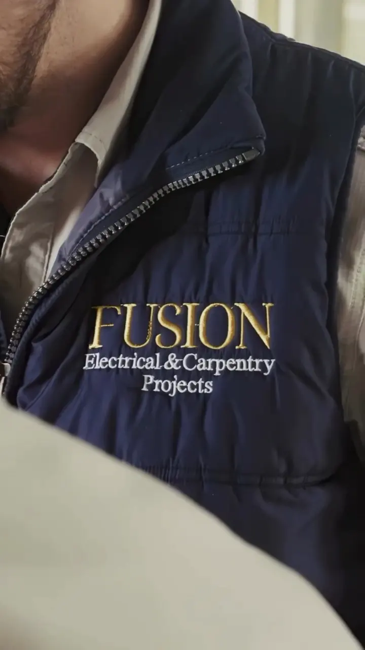 A trade business owner in a work vest, from the member video